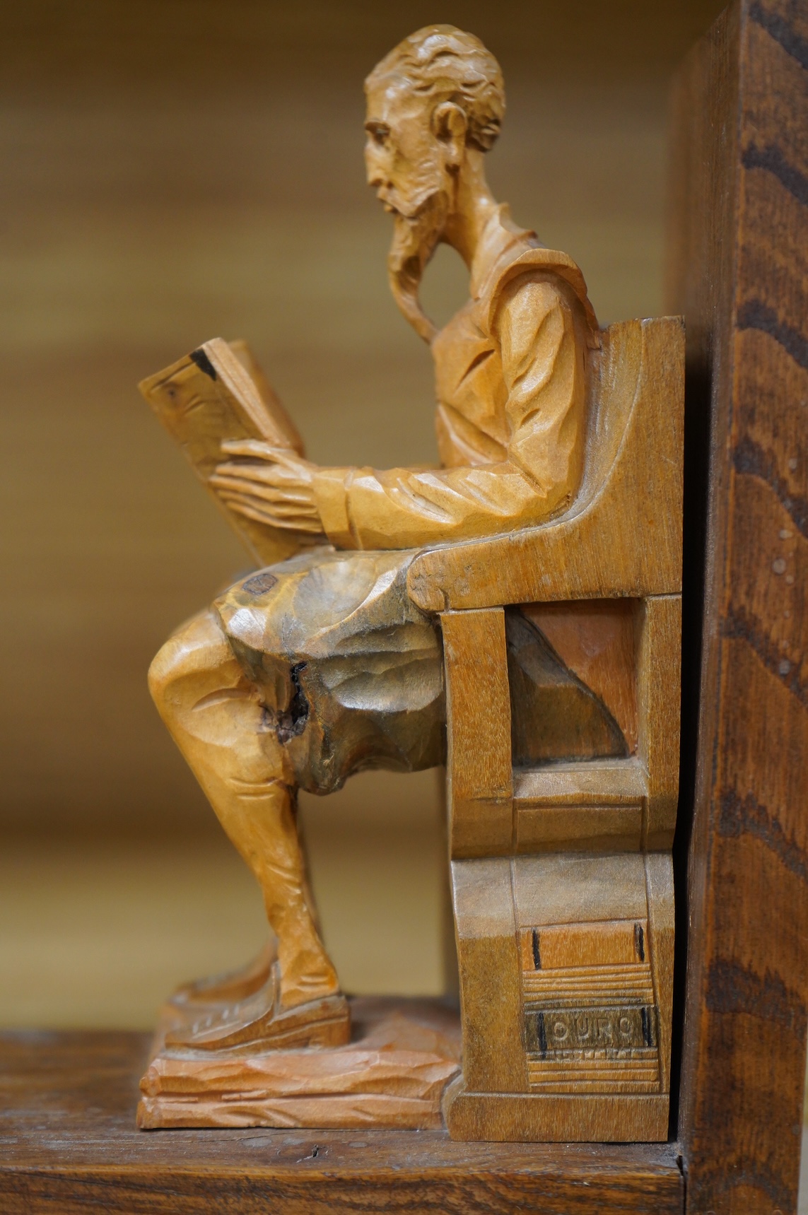 A pair of Bavarian carved wood figural bookends, 17cm high